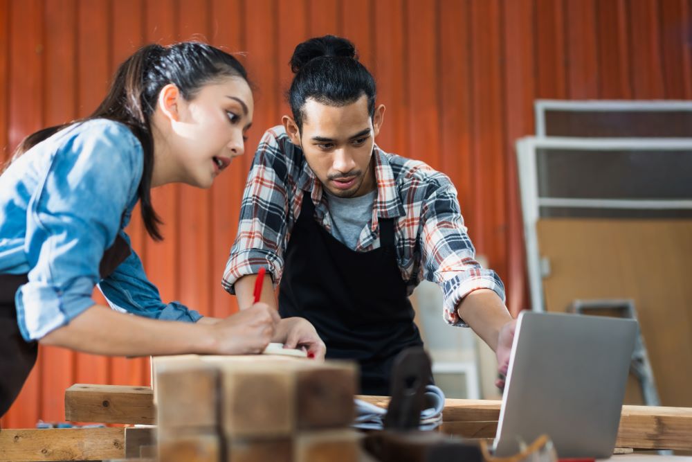 young asian couple carpenters man and woman discus 2023 11 27 05 06 26 utc